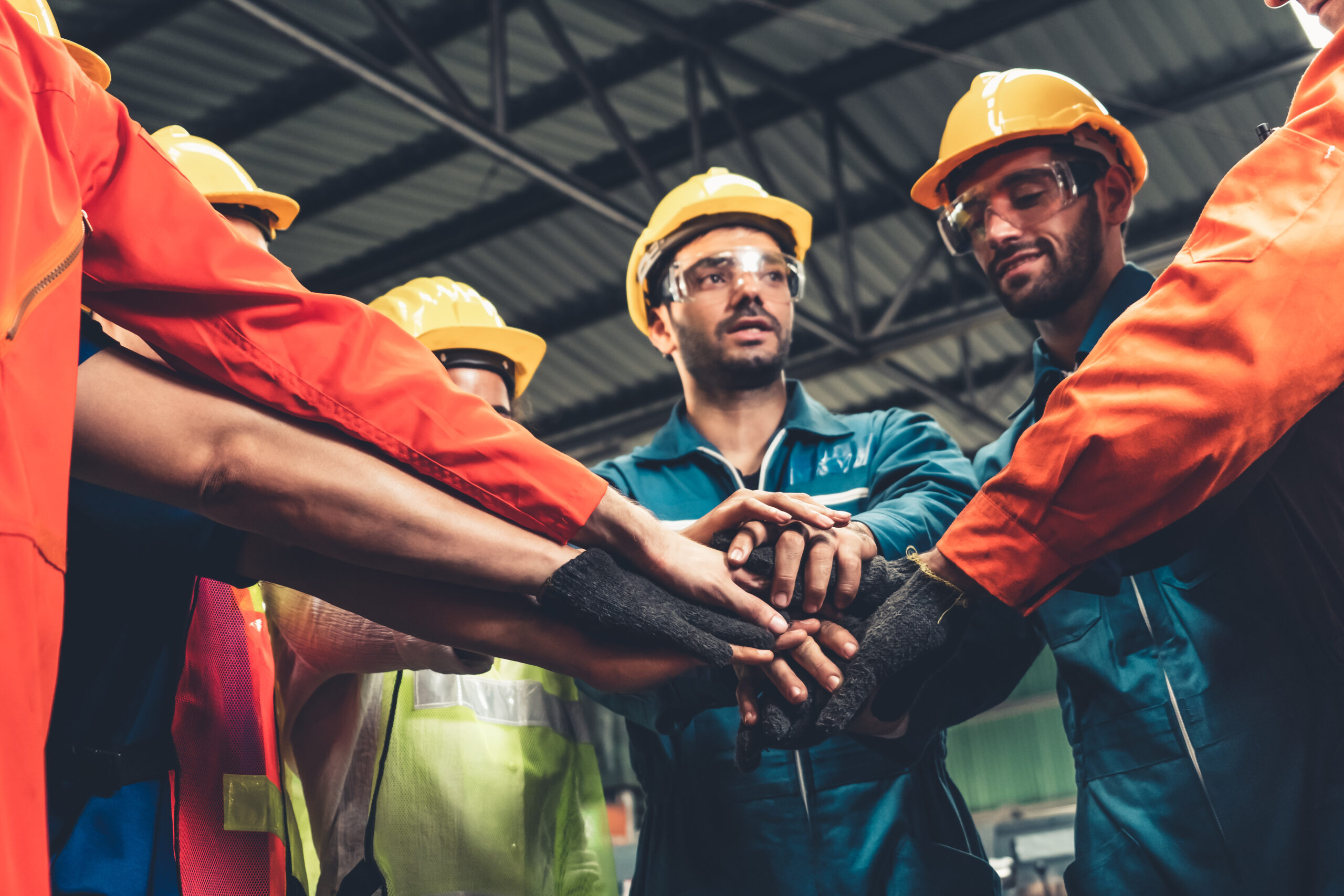 S. Clark electric workers standing together showing teamwork